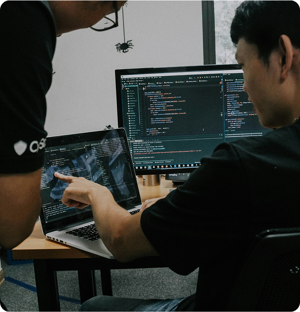 men analysing code